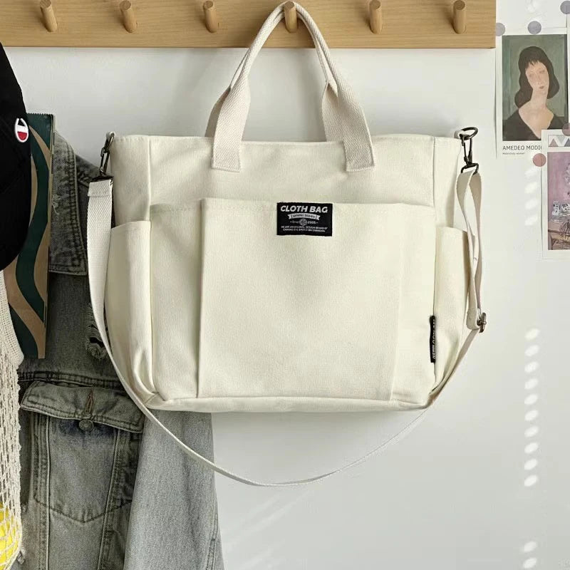 Bolsa tote portátil urbana minimalista, grande capacidade, para estudantes, de lona horizontal, com um ombro, diagonal e transversal